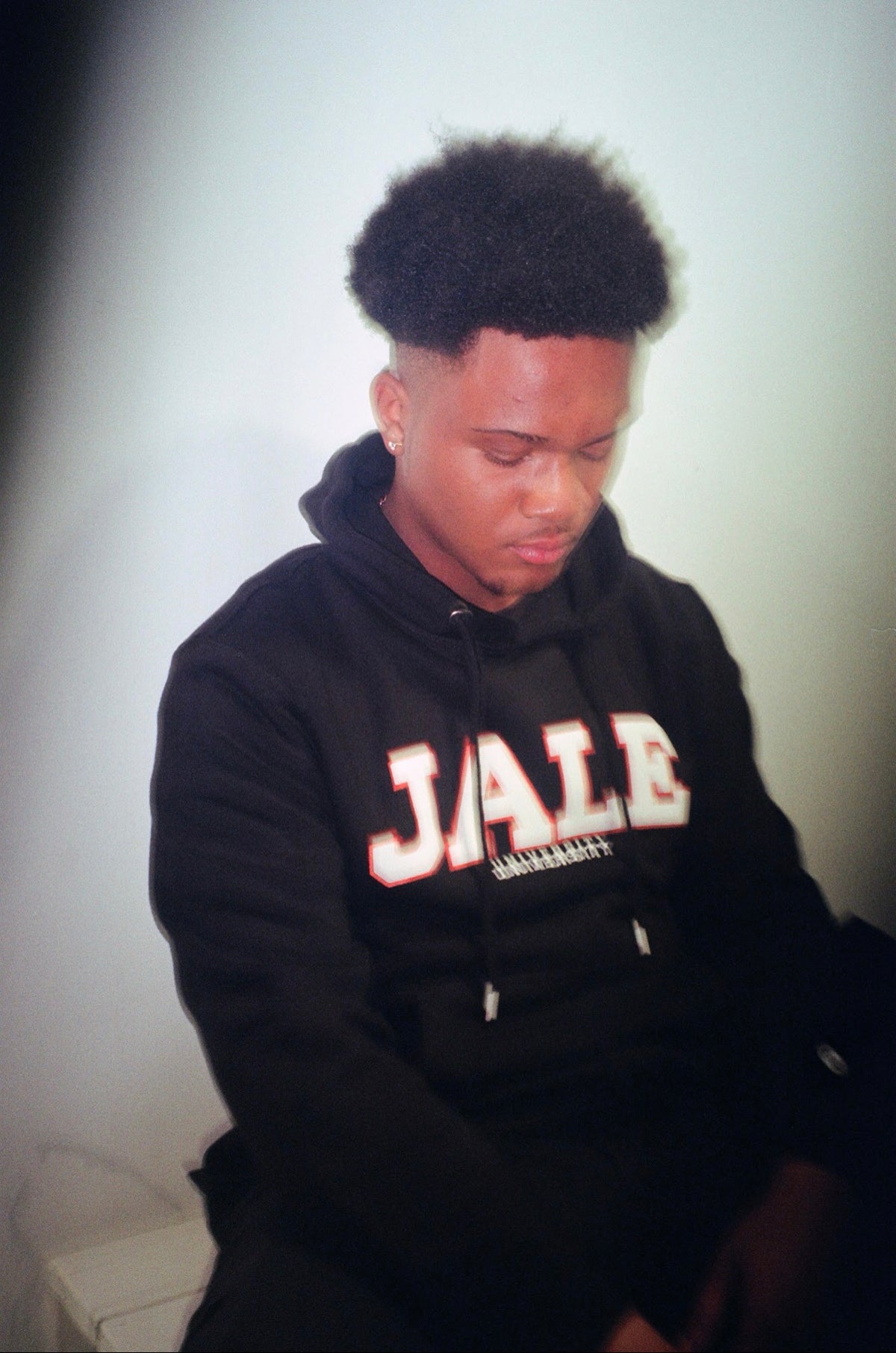model in black JALE hoodie